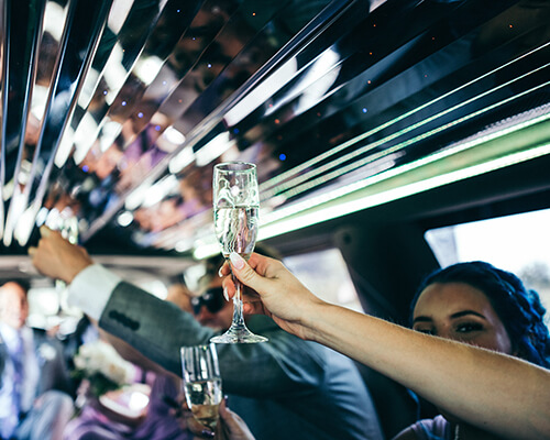 people celebrating in a limo
